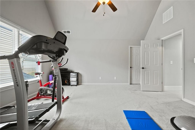 exercise room featuring lofted ceiling, carpet flooring, baseboards, and visible vents