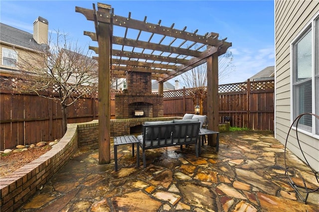 view of patio with a pergola, a fenced backyard, and an outdoor brick fireplace