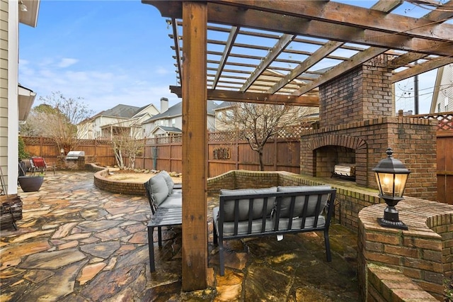 view of patio / terrace featuring an outdoor living space with a fireplace, a fenced backyard, and a pergola