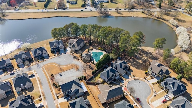 birds eye view of property featuring a residential view and a water view