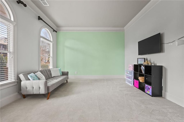 sitting room featuring baseboards, carpet, and ornamental molding