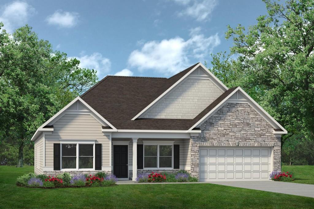 craftsman-style house featuring a garage and a front yard