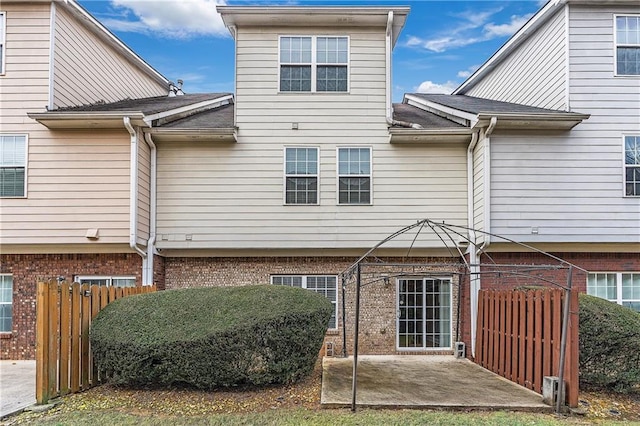 back of property with a patio area