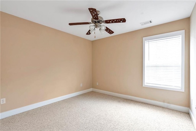 empty room with carpet floors and ceiling fan