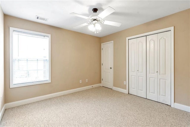 unfurnished bedroom with carpet floors and ceiling fan