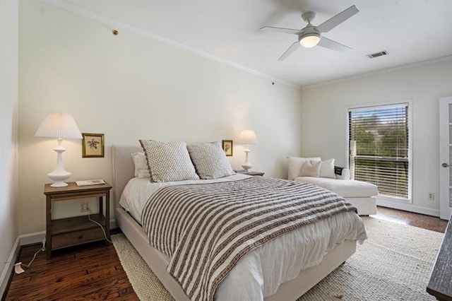 bedroom with dark hardwood / wood-style floors, ceiling fan, and ornamental molding