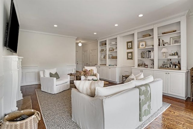 living room with crown molding and dark wood-type flooring