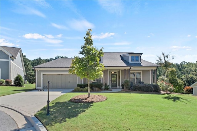 view of front of house featuring a garage and a front lawn