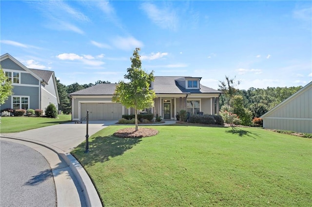 view of front facade featuring a garage and a front yard