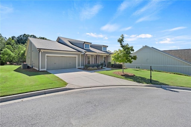 view of front of property with central AC unit, a front yard, and a garage