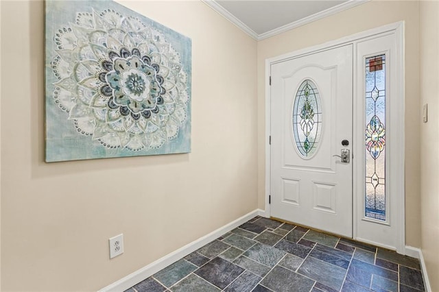 foyer featuring stone tile floors, baseboards, and ornamental molding