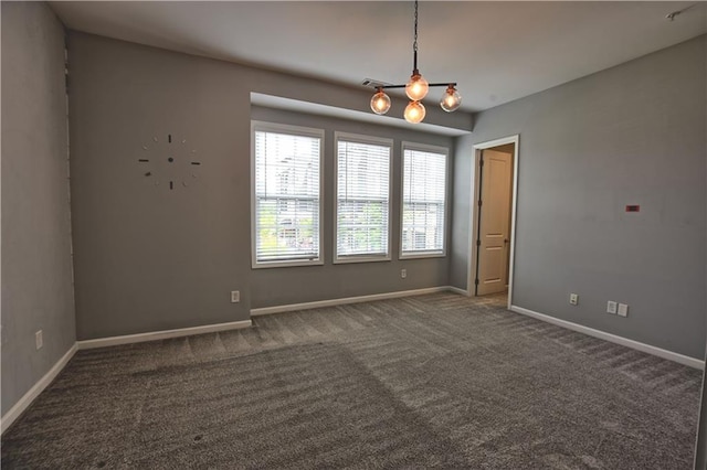6603 Sterling Dr, Atlanta, GA 30328 - carpeted spare room featuring a chandelier and baseboards