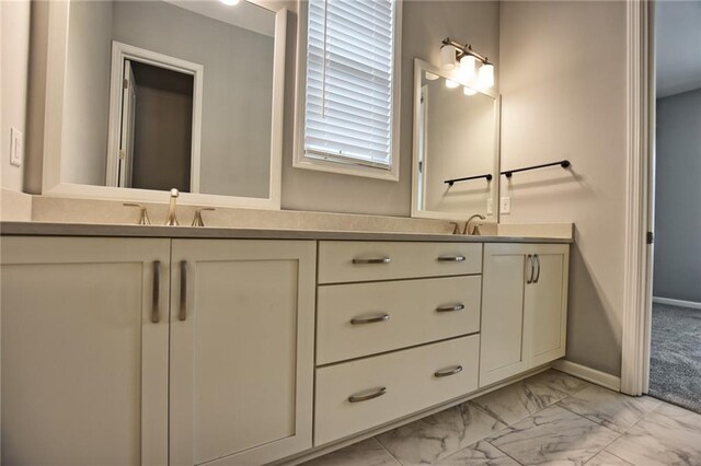 6603 Sterling Dr, Atlanta, GA 30328 - full bathroom featuring double vanity, marble finish flooring, and baseboards