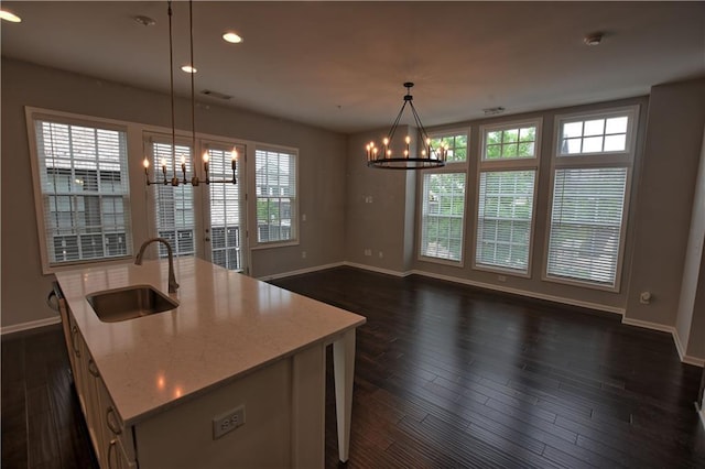 6603 Sterling Dr, Atlanta, GA 30328 - kitchen with a chandelier, a sink, baseboards, and recessed lighting