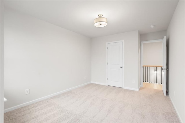 unfurnished bedroom with light colored carpet