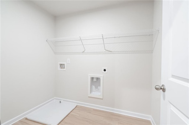 laundry area featuring wood-type flooring, hookup for an electric dryer, and hookup for a washing machine