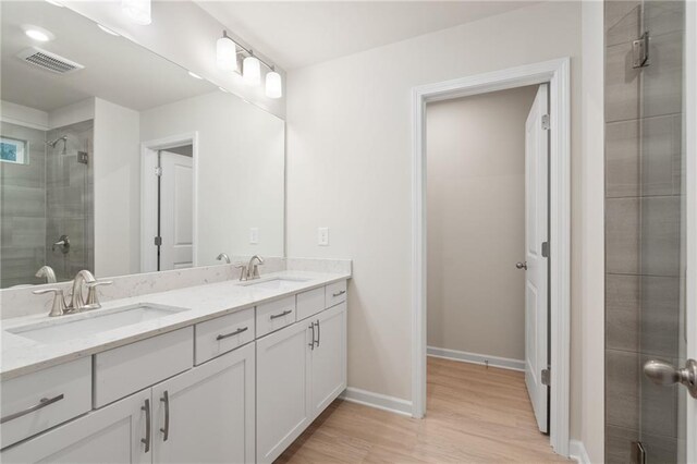 bathroom with vanity and an enclosed shower