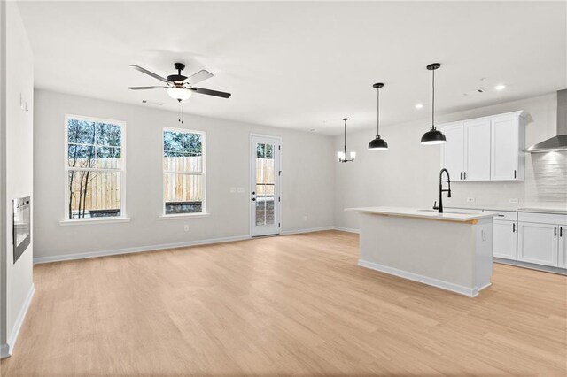 corridor with light hardwood / wood-style floors