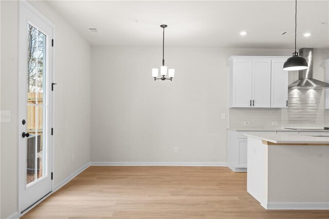 stairway with hardwood / wood-style flooring and ceiling fan