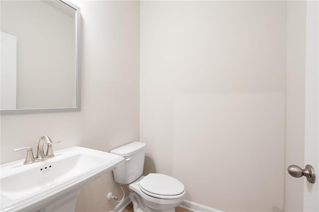 bathroom with toilet and sink