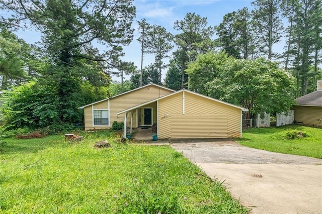 5016 Comanche Ct NW, Lilburn, GA 30047 - view of front of home with a front yard and concrete driveway