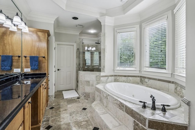 bathroom featuring a whirlpool tub, a shower stall, ornamental molding, and vanity