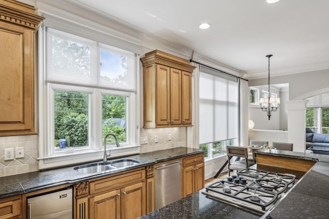 kitchen featuring a sink, gas cooktop, ornamental molding, brown cabinetry, and stainless steel dishwasher