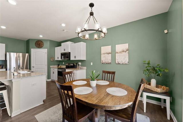 867 Starbuck Pkwy, Pendergrass, GA 30567 - dining area featuring baseboards, dark wood finished floors, and ceiling fan with notable chandelier