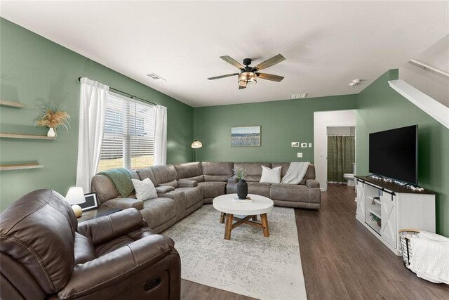 867 Starbuck Pkwy, Pendergrass, GA 30567 - living area featuring dark wood-style flooring, ceiling fan, baseboards, and stairway