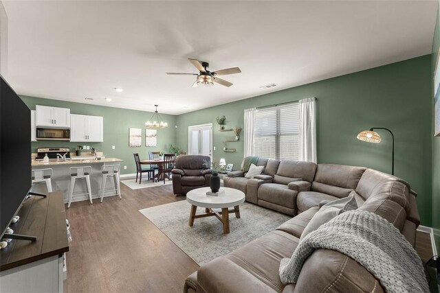 867 Starbuck Pkwy, Pendergrass, GA 30567 - living area with a ceiling fan, visible vents, and dark wood-type flooring