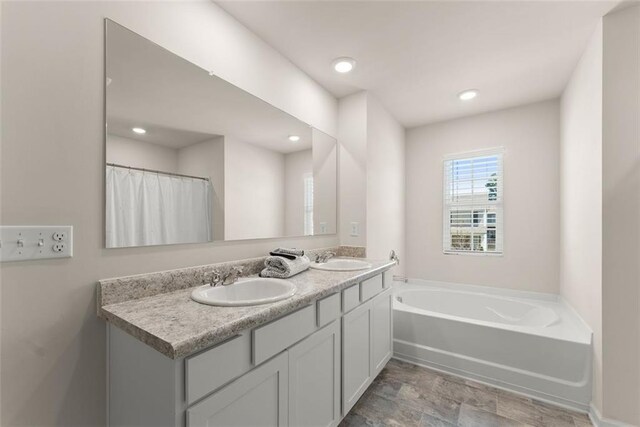 867 Starbuck Pkwy, Pendergrass, GA 30567 - bathroom with a sink, double vanity, baseboards, curtained shower, and visible vents