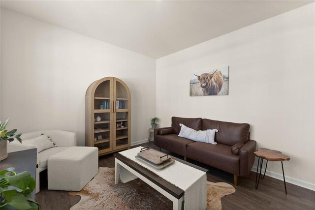 867 Starbuck Pkwy, Pendergrass, GA 30567 - living area featuring baseboards, wood finished floors, and visible vents