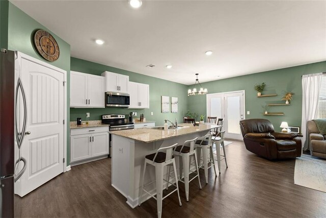 867 Starbuck Pkwy, Pendergrass, GA 30567 - living area with baseboards and wood finished floors