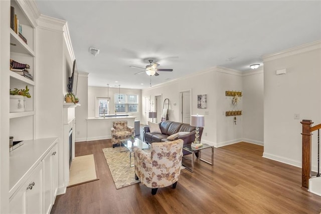 living room with crown molding, hardwood / wood-style flooring, and ceiling fan