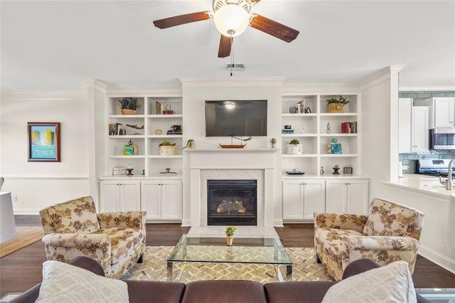 living room featuring crown molding and dark wood-type flooring