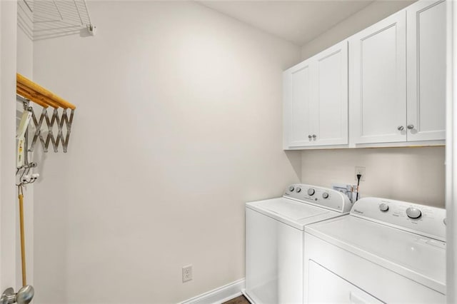 laundry room featuring cabinets and independent washer and dryer