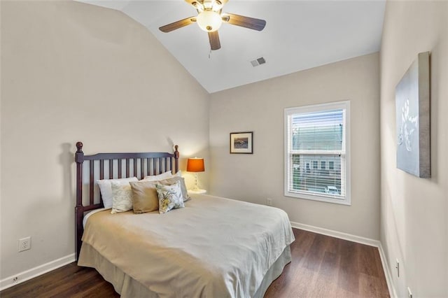 bedroom featuring ceiling fan, lofted ceiling, and dark hardwood / wood-style flooring