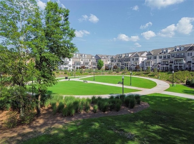 view of property's community featuring a yard