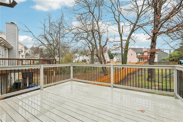 wooden deck with a residential view