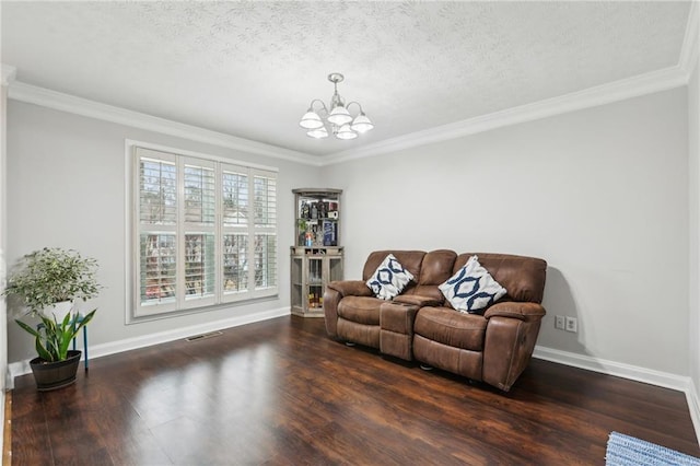 living room featuring a notable chandelier, wood finished floors, baseboards, and a textured ceiling