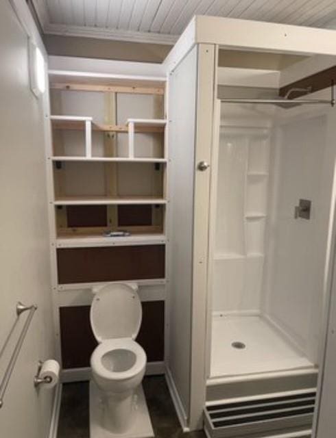 bathroom with crown molding and toilet