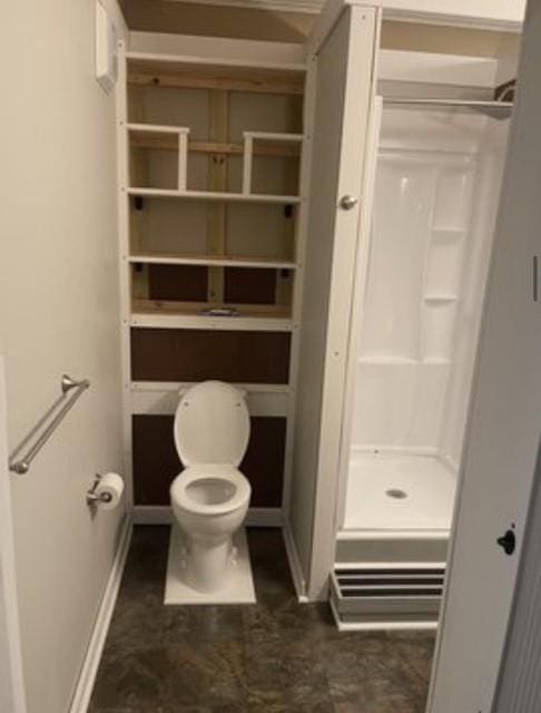 bathroom featuring walk in shower and toilet