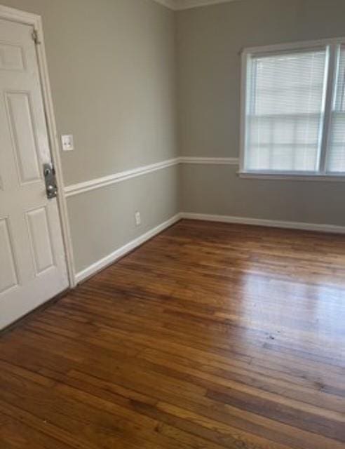 unfurnished room with dark hardwood / wood-style floors