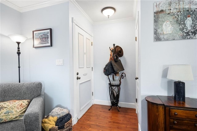 entrance foyer featuring dark wood-type flooring and ornamental molding