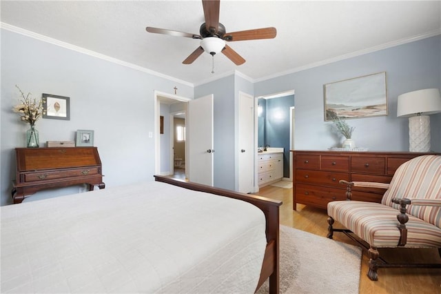 bedroom with connected bathroom, light hardwood / wood-style flooring, ceiling fan, and ornamental molding