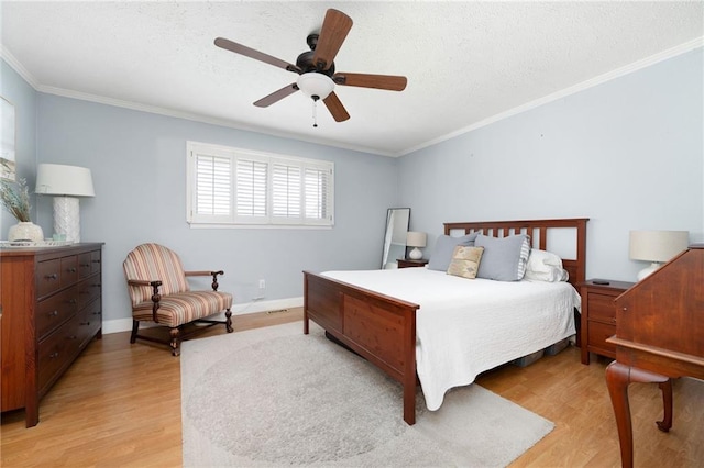 bedroom with ceiling fan, ornamental molding, and light wood-type flooring