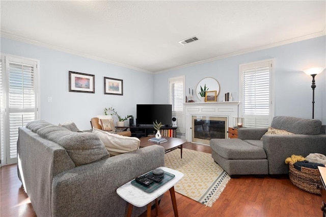 living room featuring ornamental molding and hardwood / wood-style flooring