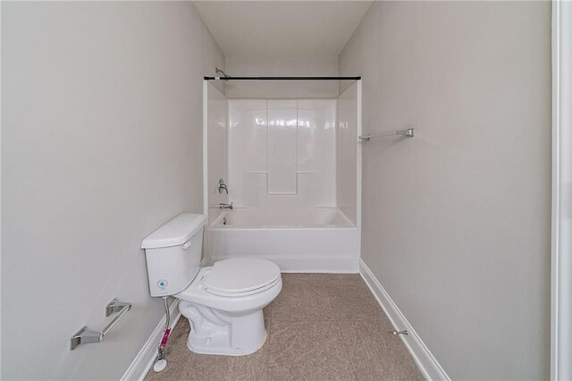 bathroom with shower / bathing tub combination and toilet