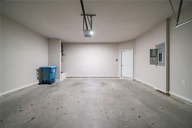 garage featuring electric panel and a garage door opener