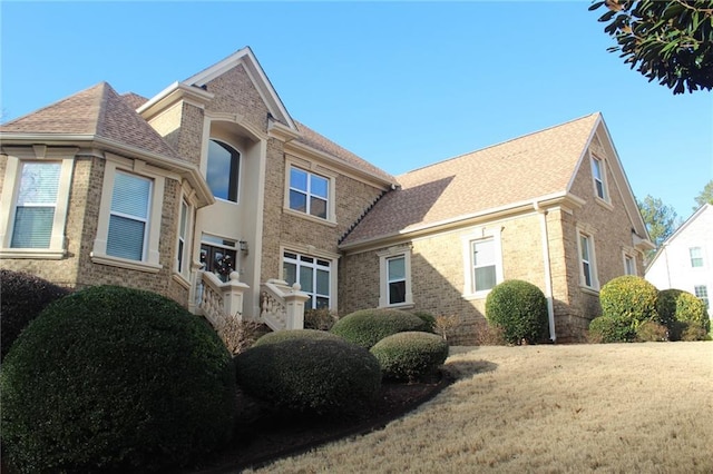 view of home's exterior featuring a yard